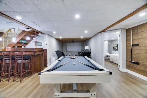 a pool table in a room with a bar at Emerald Escape Lake, Theater, Game Room & More! in Long Pond