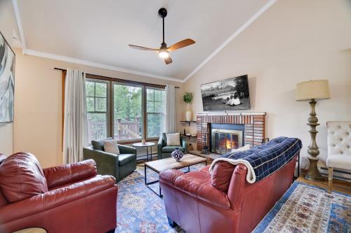 a living room with two couches and a fireplace at Emerald Escape Lake, Theater, Game Room & More! in Long Pond