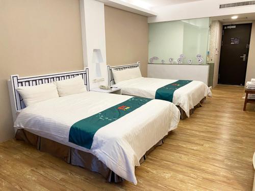 Ein Bett oder Betten in einem Zimmer der Unterkunft 明山森林會舘 The M Village