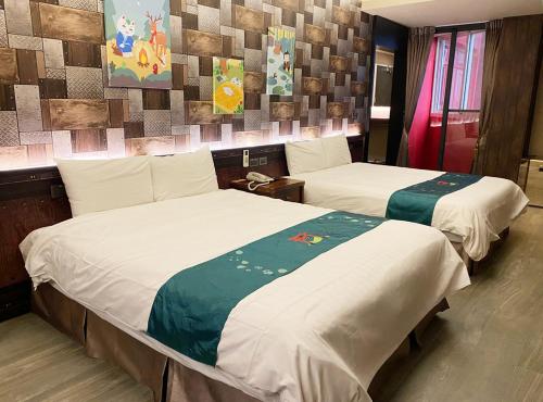 Ein Bett oder Betten in einem Zimmer der Unterkunft 明山森林會舘 The M Village