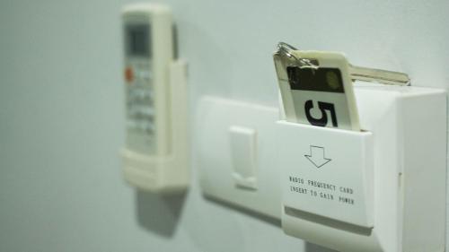 a close up of a white electrical box with a switch at Maison de Cheer in Trang