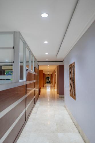 an empty hallway in a building with a long corridor at HOTEL & WISMA BINTANG JADAYAT in Bogor