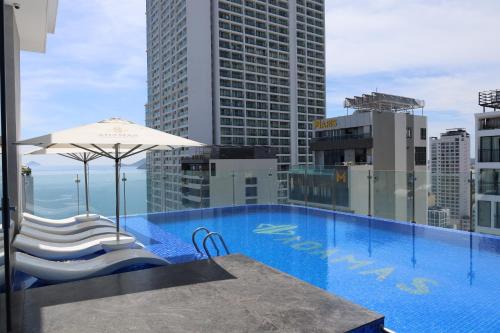 a large swimming pool on top of a building at Adamas Boutique Hotel Nha Trang in Nha Trang