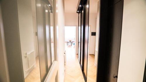 a hallway with a sliding glass door in a room at Apartment by the Old Town Square in Prague