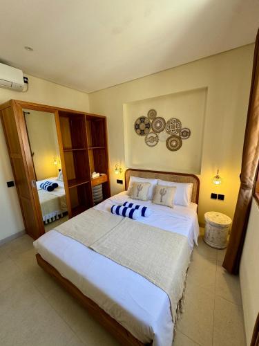 a bedroom with a large bed in a room at Casa Deva in Uluwatu