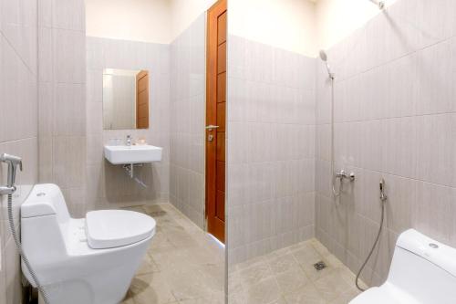 Koupelna v ubytování OYO 94746 Raz Residence