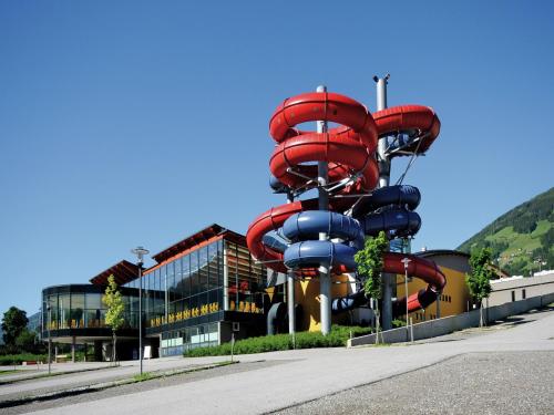 a large water slide in front of a building at Apartment with balcony in Hart im Zillertaler in Fügen