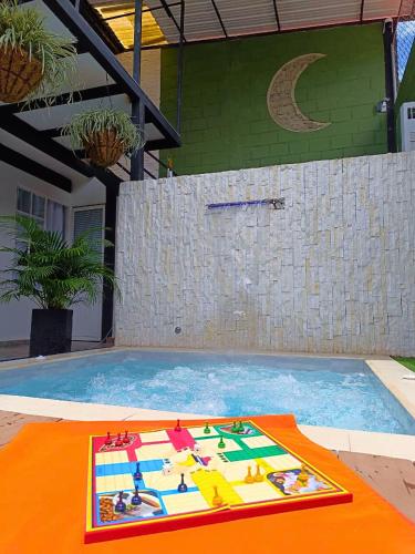 a large swimming pool with a toy in the water at Casa Luna Lago Calima in Calima