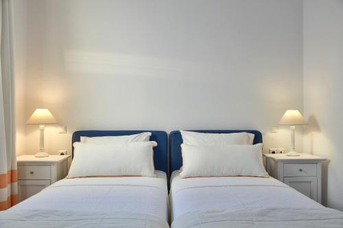Ένα ή περισσότερα κρεβάτια σε δωμάτιο στο Archipelagos Hotel - Small Luxury Hotels of the World