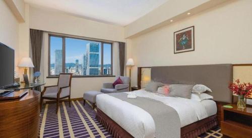 Postel nebo postele na pokoji v ubytování Kunming Jinjiang Hotel