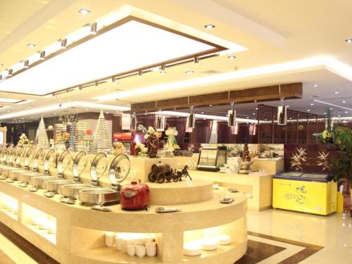 a store with a counter with dishes on display at Yanji Yanbian International Hotel in Yanji