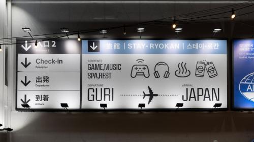 a sign in a building with signs on it at Stay Passport Airplane Guri in Guri