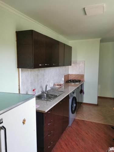 an empty kitchen with a sink and a stove at Hovit in Khachʼik