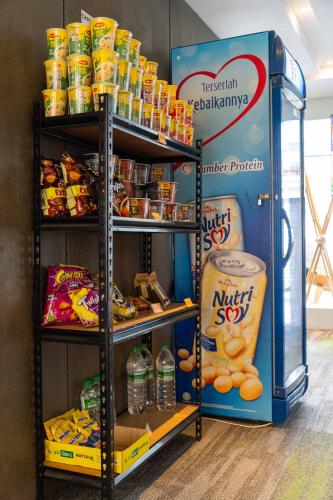 a vending machine filled with lots of food and drinks at T+ Hotel Butterworth in Butterworth