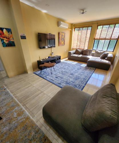 a living room with a couch and a table at Carolina Point Resort in Crown Point