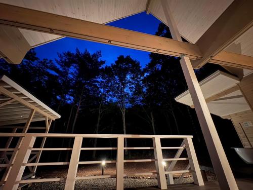 a view from the inside of a screened in porch at night at Second House kukka in Naganohara