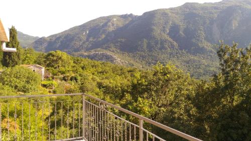 a balcony with a view of a mountain at Apartment Mond in Virpazar