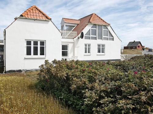 a white house with a red roof at 4 person holiday home in Lemvig-By Traum in Trans