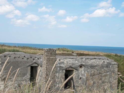 an old building on the side of a beach at 4 person holiday home in Lemvig-By Traum in Trans