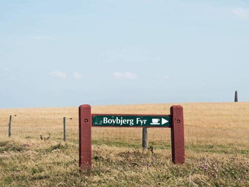a street sign in the middle of a field at 4 person holiday home in Lemvig-By Traum in Trans