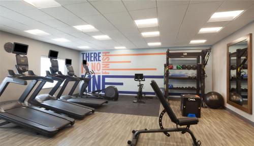 a gym with cardio equipment and tread machines at Hampton Inn Evergreen in Evergreen