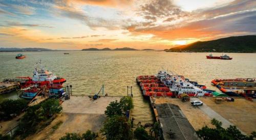 a group of boats docked at a dock in the water at Lake Inn Hotel in Songkhla