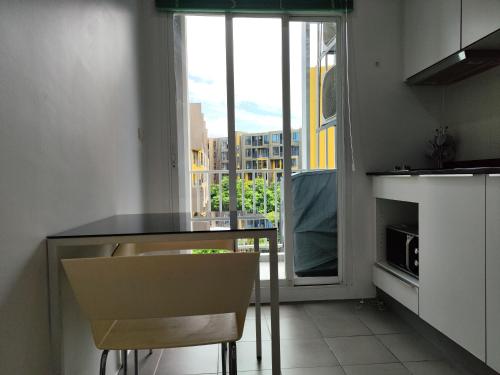 a kitchen with a counter and a sink and a window at 5 Floor - The Base Downtown Condominium next to Central Shopping Mall in Phuket