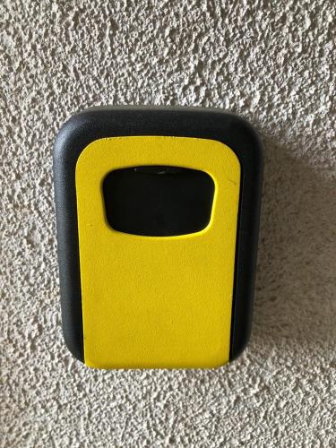 a yellow and black object sitting on the floor at Cabañas Diarias in Valdivia