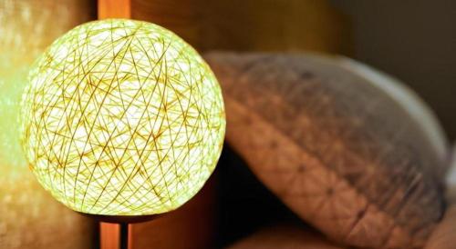 a light on a wooden pole with a object at Jeju Sejong Hotel in Jeju