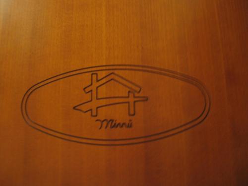 a close up of a sign on a wooden door at Hotel Bed & Breakfast Minu' in Paravati