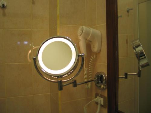 a mirror in a bathroom with a blow dryer at Hotel Bed & Breakfast Minu' in Paravati