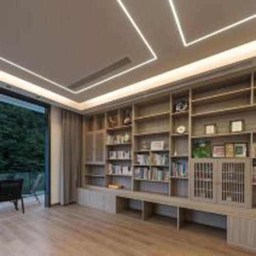 a living room with a large book shelf with books at Anji Xishan Linyu Chinese-style Spring · Stream Tracing · Vacation Boutique Inn in Anji