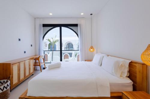 Ένα ή περισσότερα κρεβάτια σε δωμάτιο στο Villa Amal 9