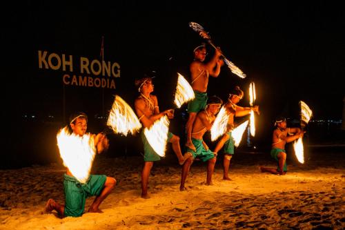 a group of young boys with lights on the beach at Onederz Koh Rong in Koh Rong
