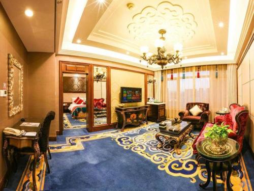 a large living room with a chandelier at Hohhot Inner Mongolia Hotel in Hohhot