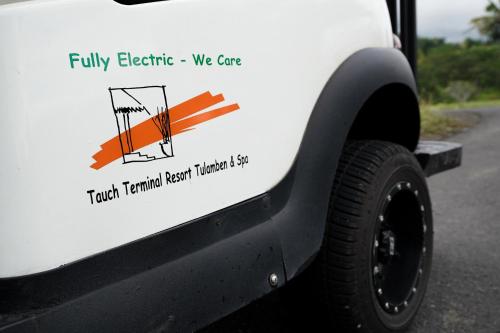 a sticker on the side of a white truck at Tauch Terminal Resort Tulamben & Spa in Tulamben