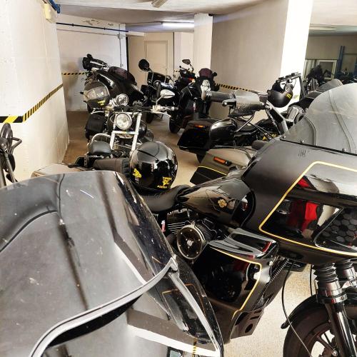 a group of motorcycles parked in a garage at Borgo Degli Ulivi in Àrbatax