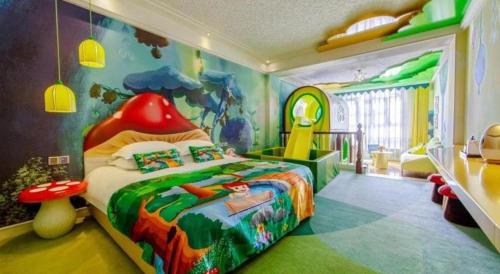 a childs bedroom with a bed in a room with aesame at Hangzhou The First World Hotel in Hangzhou