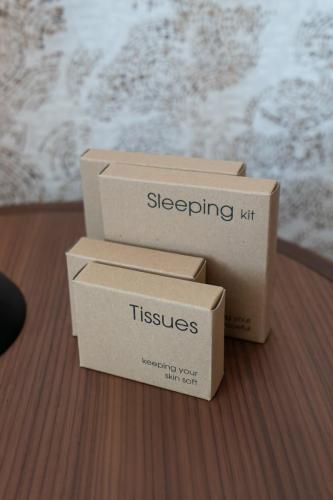 two cardboard boxes sitting on top of a table at Melia Venezia Lido in Venice-Lido