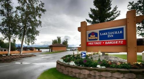 a sign for a lake lucifer inn with a street at Best Western Lake Lucille Inn in Wasilla