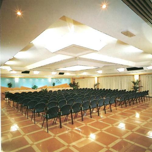 a large room with a lot of chairs in it at Hotel Piol in Limana