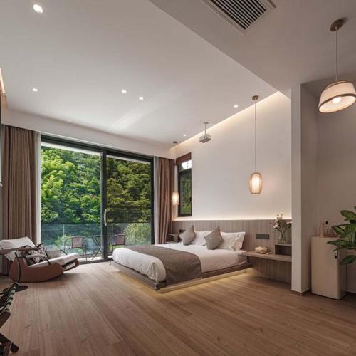 a bedroom with a large bed and a large window at Anji Xishan Linyu Chinese-style Spring · Stream Tracing · Vacation Boutique Inn in Anji