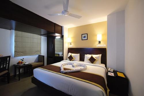 Ένα ή περισσότερα κρεβάτια σε δωμάτιο στο Hotel Gandharva- A Green Hotel