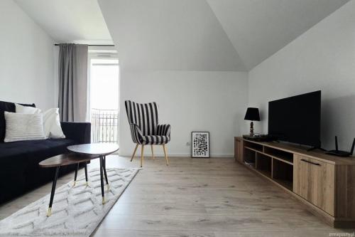 Μια τηλεόραση ή/και κέντρο ψυχαγωγίας στο APARTAMENT ZEN winda klimatyzacja dobra energia