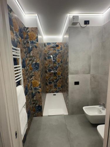 a bathroom with a shower and a sink at Corte Ongaro Hotel in Verona