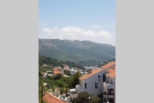 a view of a city with mountains in the background at Apartments M&E in Mokošica