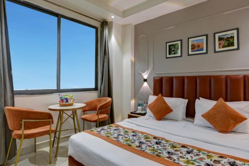 Voodi või voodid majutusasutuse Qotel Comfort AT Residency Kaushambi Anand Vihar toas