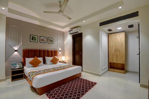 Voodi või voodid majutusasutuse Qotel Comfort AT Residency Kaushambi Anand Vihar toas