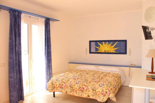 Ένα ή περισσότερα κρεβάτια σε δωμάτιο στο Hotel del Sole