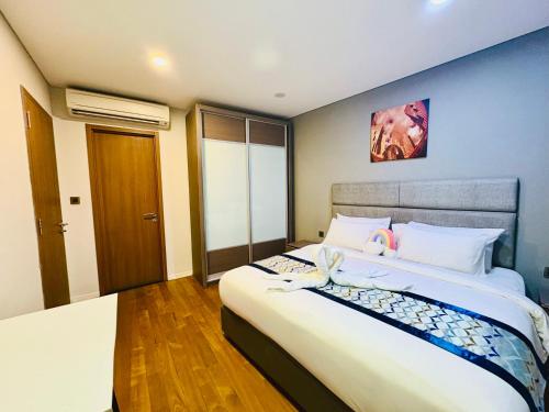 Postel nebo postele na pokoji v ubytování Vortex Suites Klcc by Dynasty